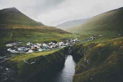 Scenic view of faroe islands against cloudy sky