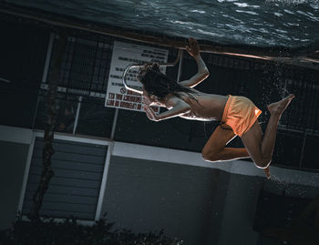 Low section of woman swimming in sea