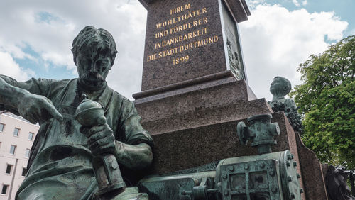 Low angle view of statue against building