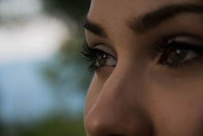 Close-up of young woman eyes looking away