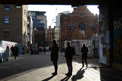 People walking on street in city