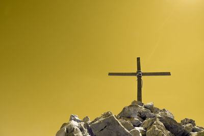 Low angle view of statue against temple against sky