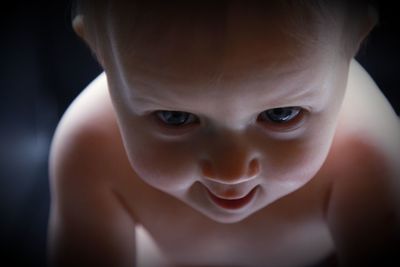 Close-up portrait of cute baby. mysterious face of a newborn baby