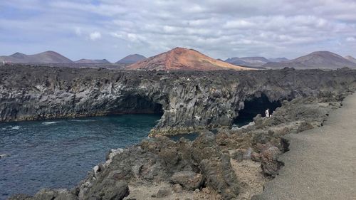 Scenic view of landscape and mountains against sky