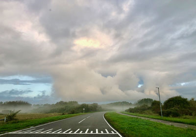 Empty road against sky