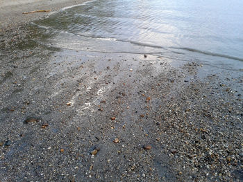 High angle view of wet sand on beach