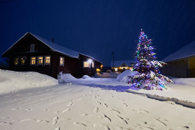 Snow covered field against sky