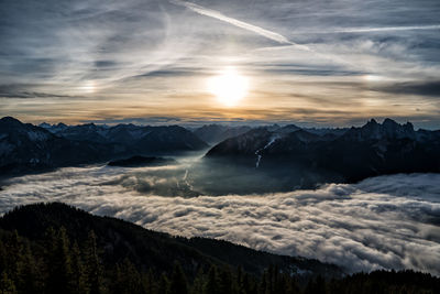 Scenic view of snowcapped mountains against sky during sunset