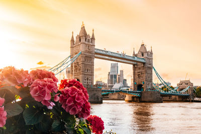 Close-up of clock tower bridge over river