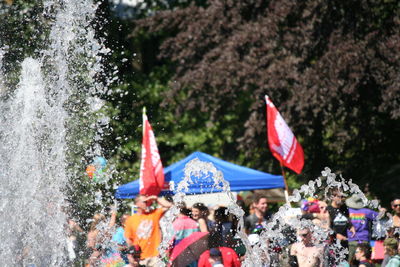 Close-up of people in pond