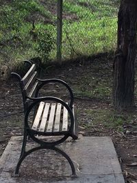 Empty chair against trees