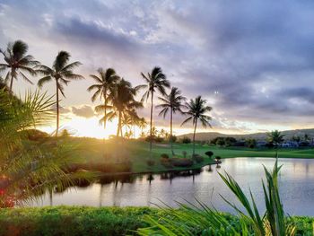 Scenic view of lake against sky at sunset