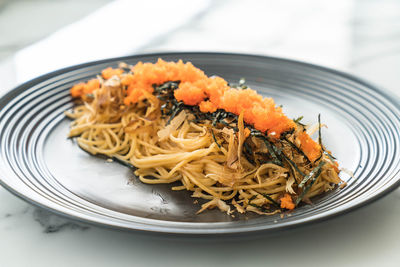 Close-up of noodles served in plate