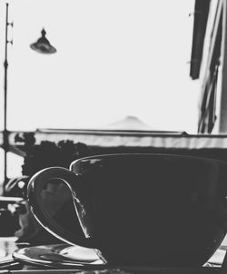 Close-up of coffee cup against clear sky