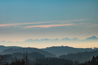 Scenic view of silhouette mountains against sky during sunset