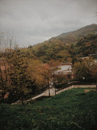 Scenic view of mountain against cloudy sky