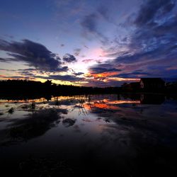 Scenic view of lake against romantic sky at sunset