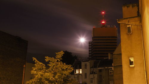 Low angle view of illuminated buildings at night