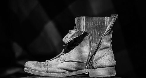 Close-up of boot on table