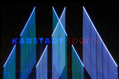 Close-up of illuminated arrow symbol at night