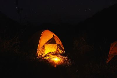 Low angle view of illuminated lantern at night