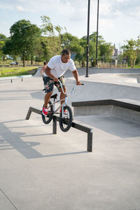 Man riding bicycle on street in city