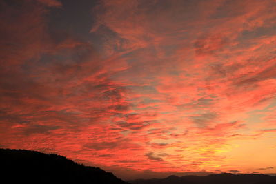 Low angle view of dramatic sky during sunset