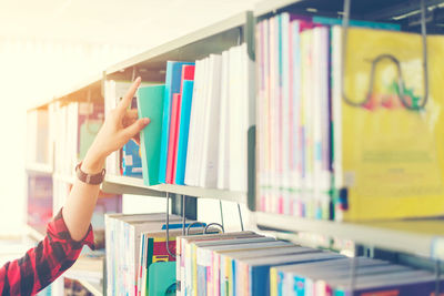 Boy reading book in library
