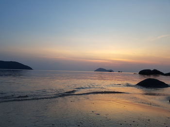 Scenic view of sea against sky at sunset