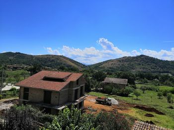 Houses and buildings against sky