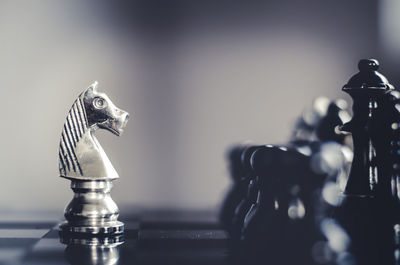 Close-up of chess pieces on table