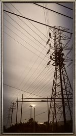 Low angle view of electricity pylon