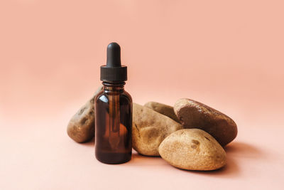 Close-up of bottle on table against white background