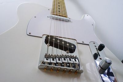 High angle view of guitar on wall