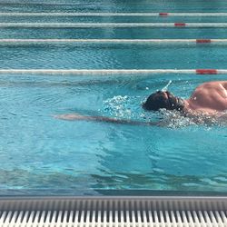 High angle view of man swimming in pool