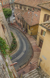 High angle view of street amidst buildings in town