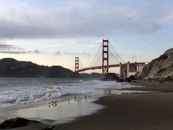 View of suspension bridge over sea