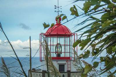 Red bell tower against sky