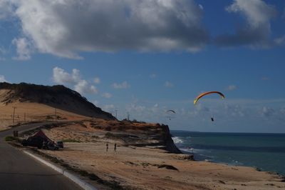 Person flying over sea