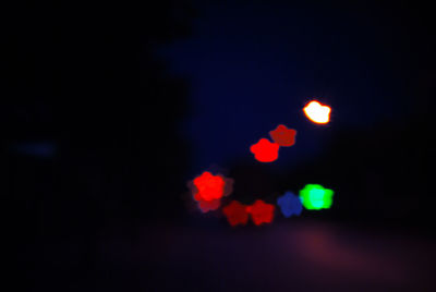 Defocused image of illuminated lights in the dark