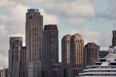 Skyscrapers in city against sky