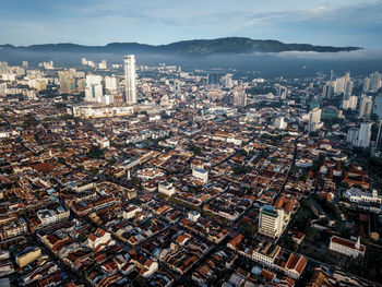 High angle view of modern buildings in city against sky