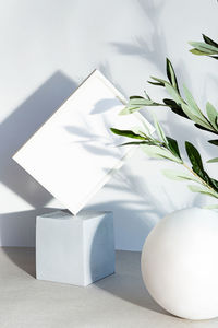 Mockup poster frame in the interior of geometric shapes. modern still life with white photo frame 