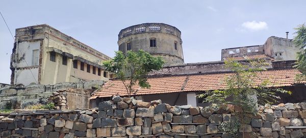 Low angle view of old building against sky