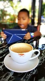 Close-up of coffee cup on table