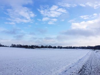 Scenic view of snow field against sky