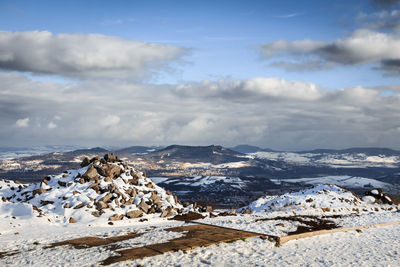 Scenic view of mountains against sky during winter