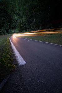 Blurred motion of car on road at night