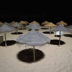 Parasols on beach against sea