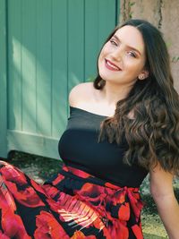 Portrait of smiling young woman with long hair